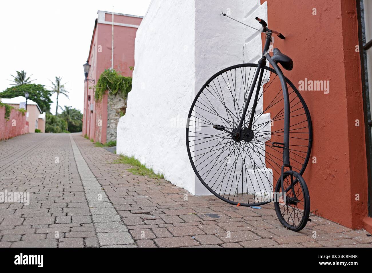 Vintage bicycle with one big wheel and one small.The penny-farthing, also known as a high wheel,high wheeler,first machine to be called a bicycle. Stock Photo