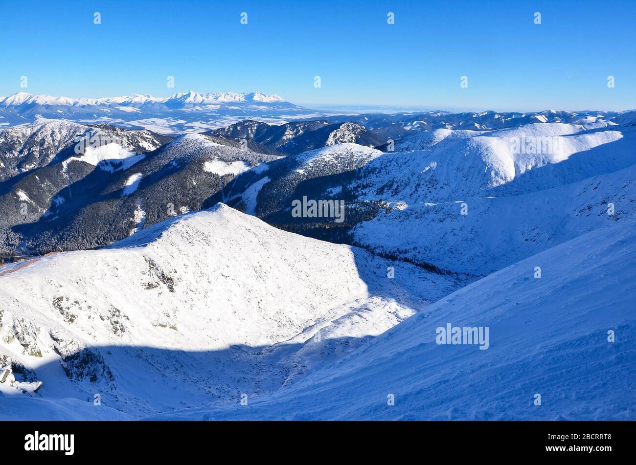 Mountains covered in snow and clouds in valley. Background photo Stock ...