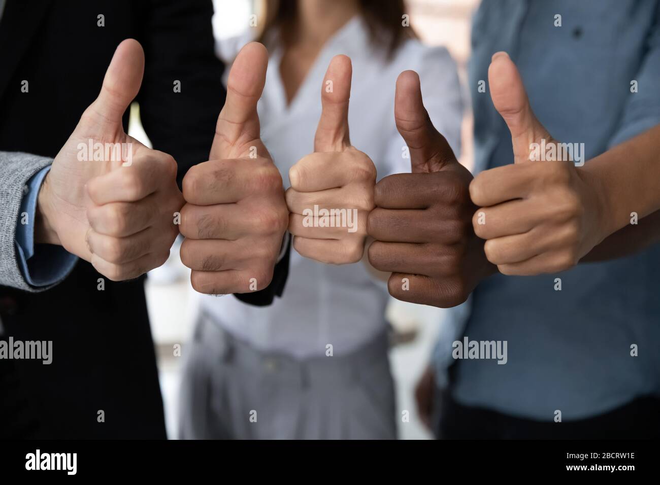 Diverse business team people hands showing thumbs up. Stock Photo