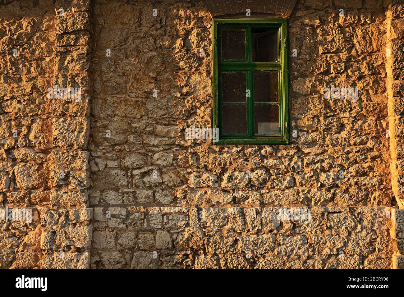 old traditional house facade with stone wall, Caransebes, Romania Stock Photo