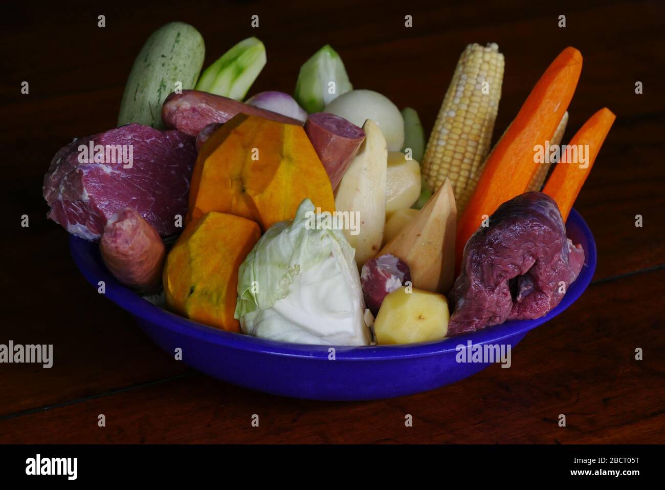 A isolated bowl of vegetables and meat ready to be cooked as a Portuguese Cozido. Stock Photo