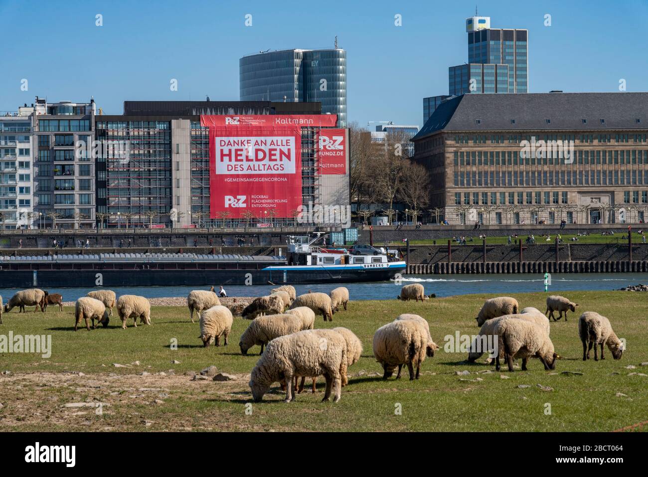 A construction company has hung a large poster on the Rhine promenade, with thanks to the heroes of everyday life, on the facade of a house, DŸsseldor Stock Photo