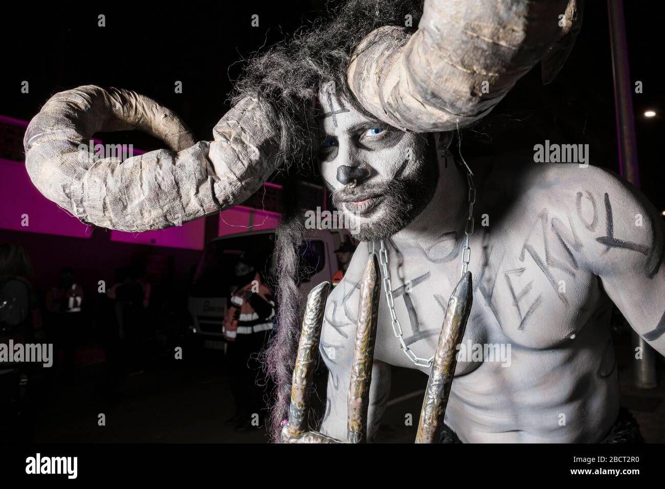 A man, dressed up as a wild animal, partying in the streets during the funeral procession Burial of the Sardine Stock Photo