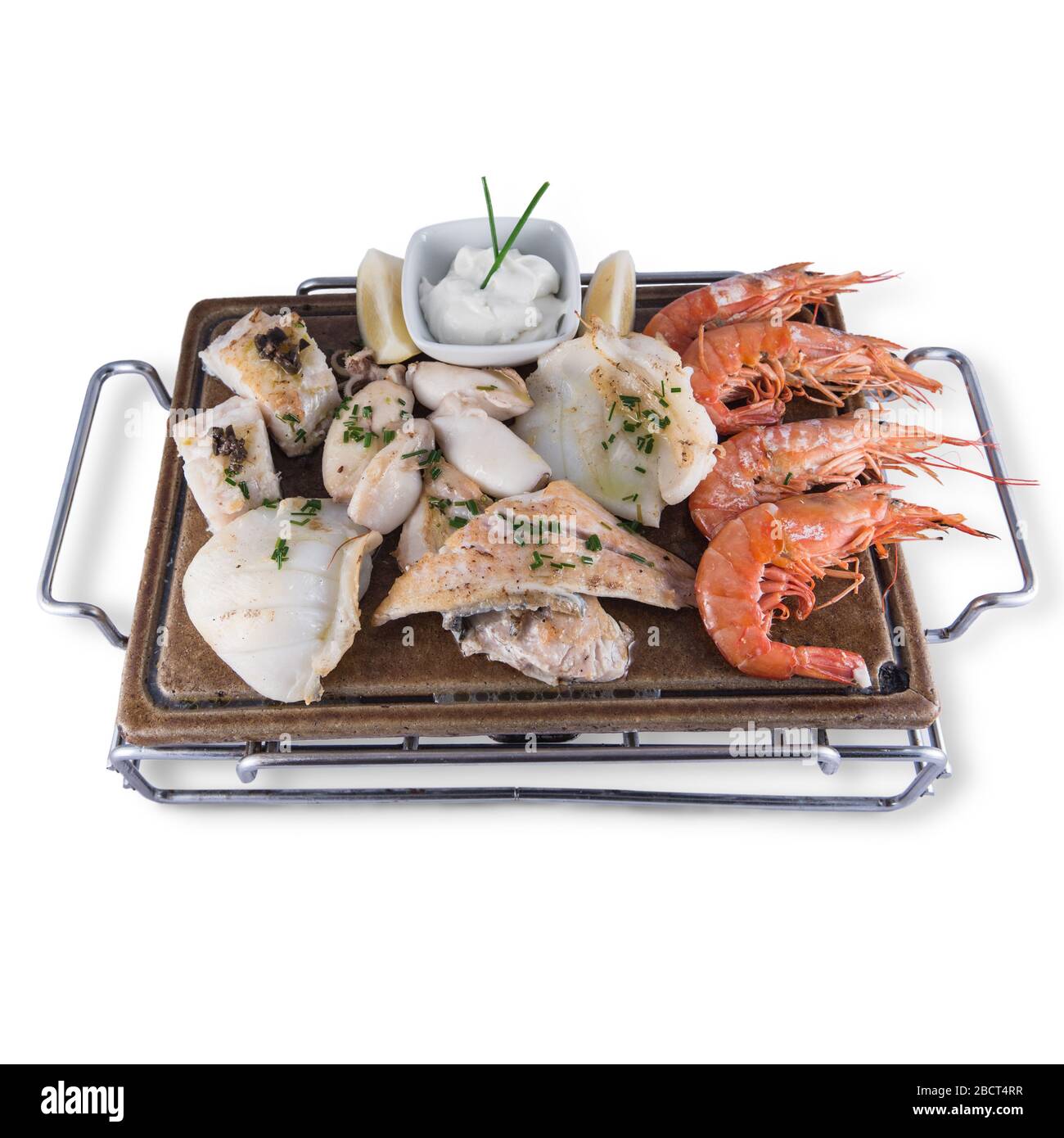 Grilled fish dish with cuttlefish, prawns, hake, sole and squid. Stock Photo