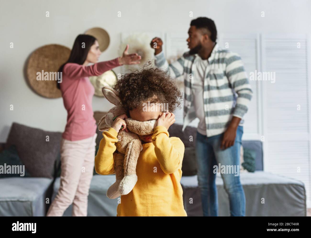Baby cries when international parents are quarrel Stock Photo