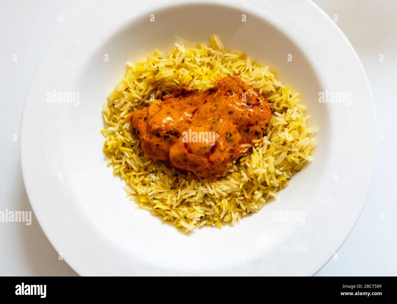 Indian butter chicken curry with pilau rice Stock Photo Alamy