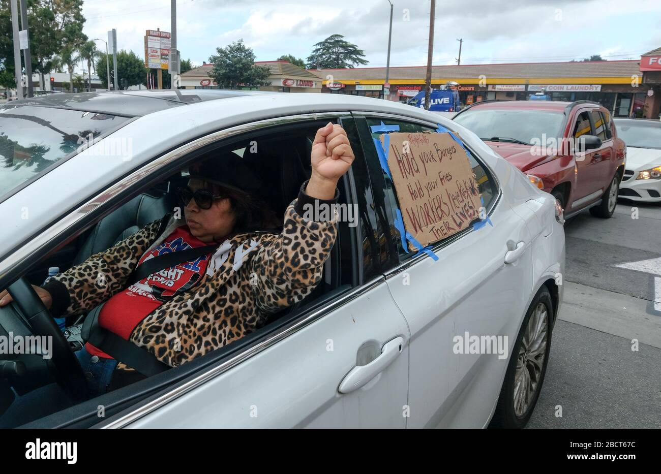 Los Angeles, California, USA. 5th Apr, 2020. A worker takes part in a drive-thru ''strike'' at a McDonald's restaurant on Sunday, April 5, 2020 in Los Angeles. The workers are demanding a two-week quarantine period, with full pay for a co-worker who tested positive for COVID-19. Credit: Ringo Chiu/ZUMA Wire/Alamy Live News Stock Photo