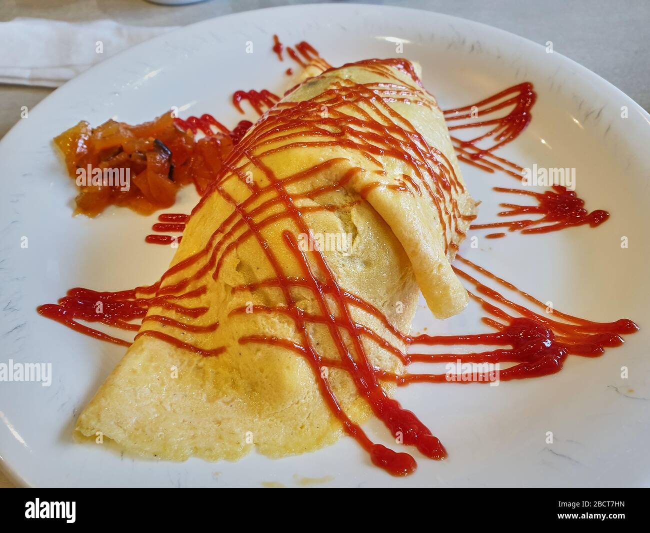 Japanese dish of rise covered by egg pancake Stock Photo Alamy