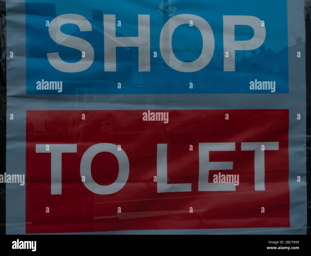 Shop to let sign in shop window during the Coronavirus, Covid 19 Pandemic. West Midlands. April 2020. UK Stock Photo