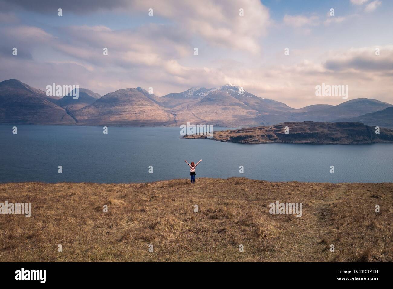 Scottish girl observing the scenery on the Isle of Mull Stock Photo