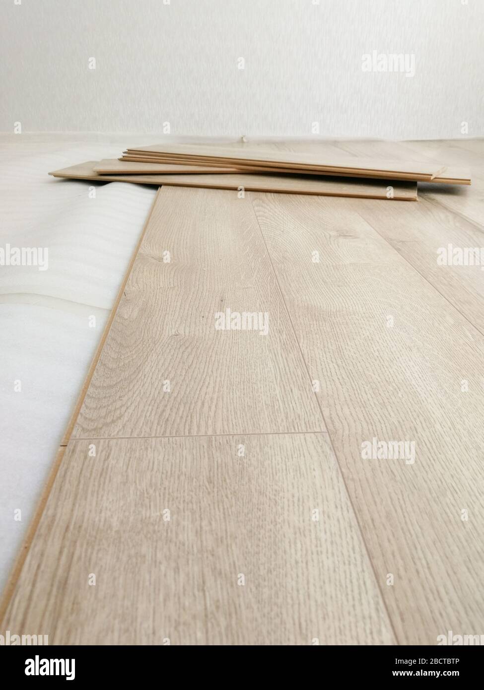 Close up of laminated flooring during replacing process Stock Photo