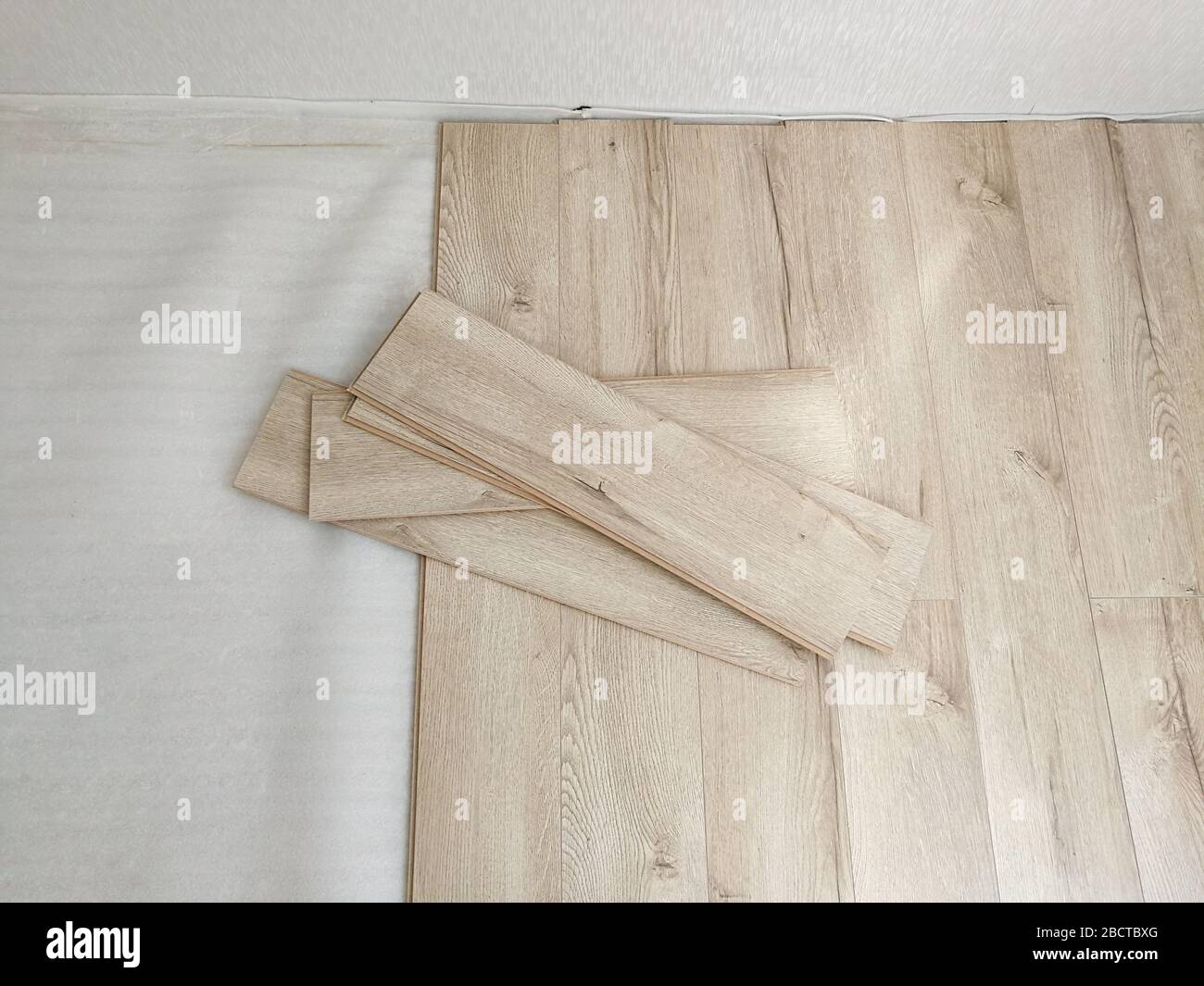 Close up of laminated flooring during replacing process Stock Photo