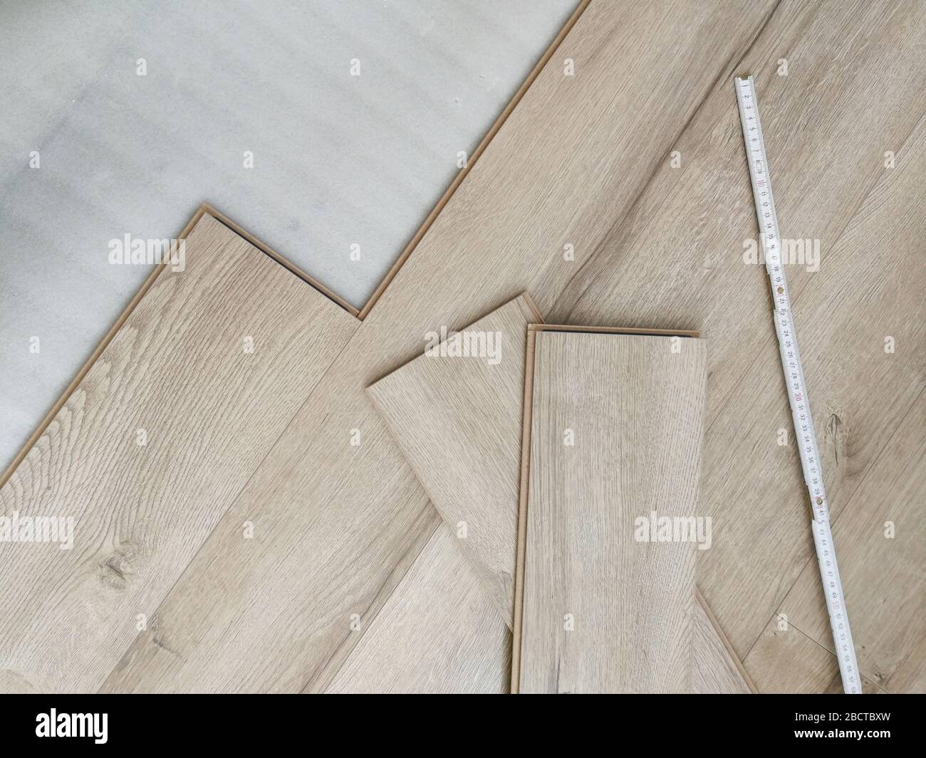 Close up of laminated flooring during replacing process Stock Photo