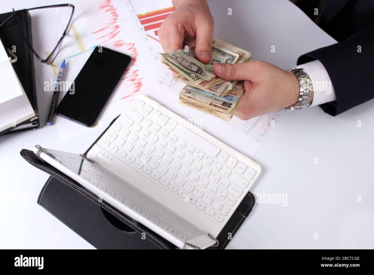 Hands of businessman with paper money. Home office. Counting the salary