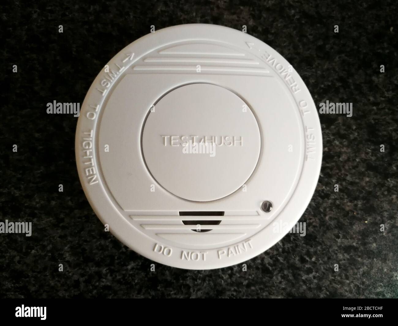 Plastic smoke alarm sensor isolated on the dark background Stock Photo ...