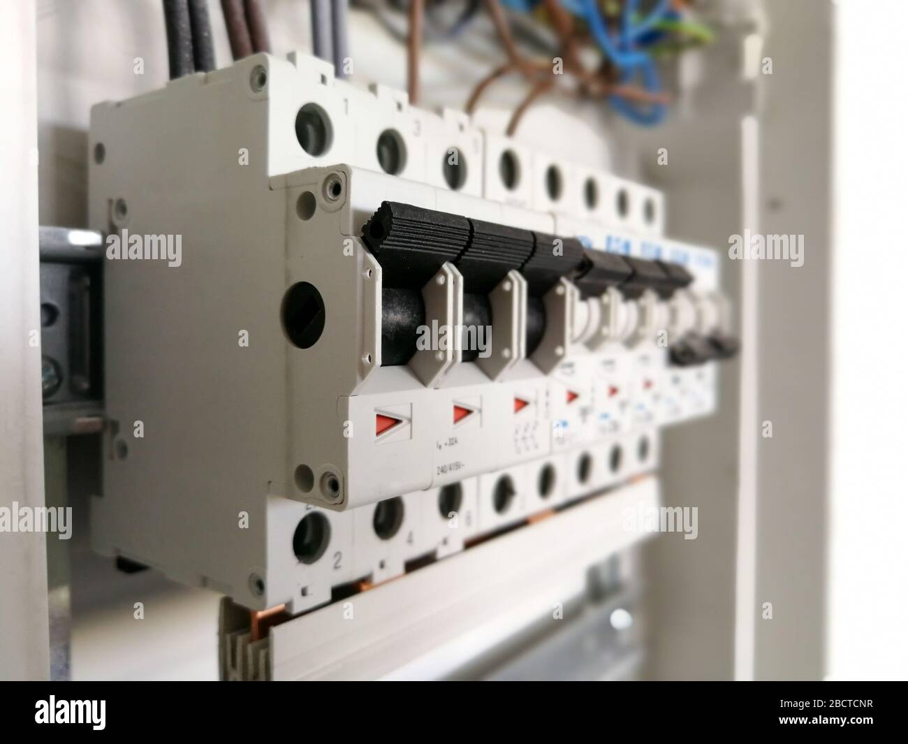 Electric safety switches and wiring inside electrical panel Stock Photo