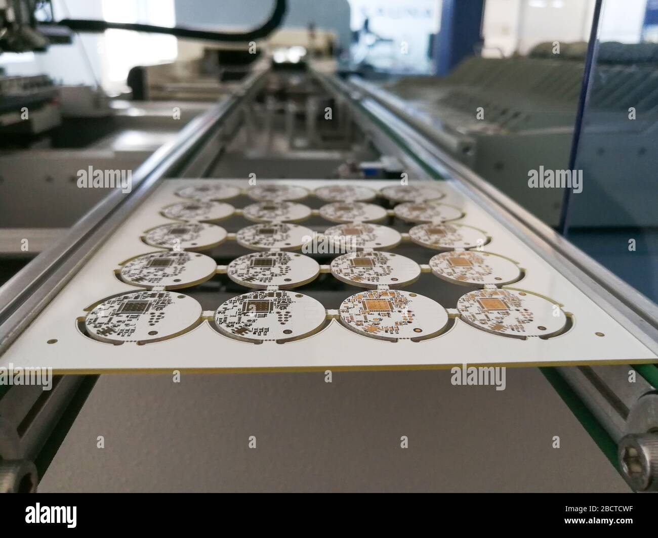 PCB assembly first stages. PCB on the rails of production line inside