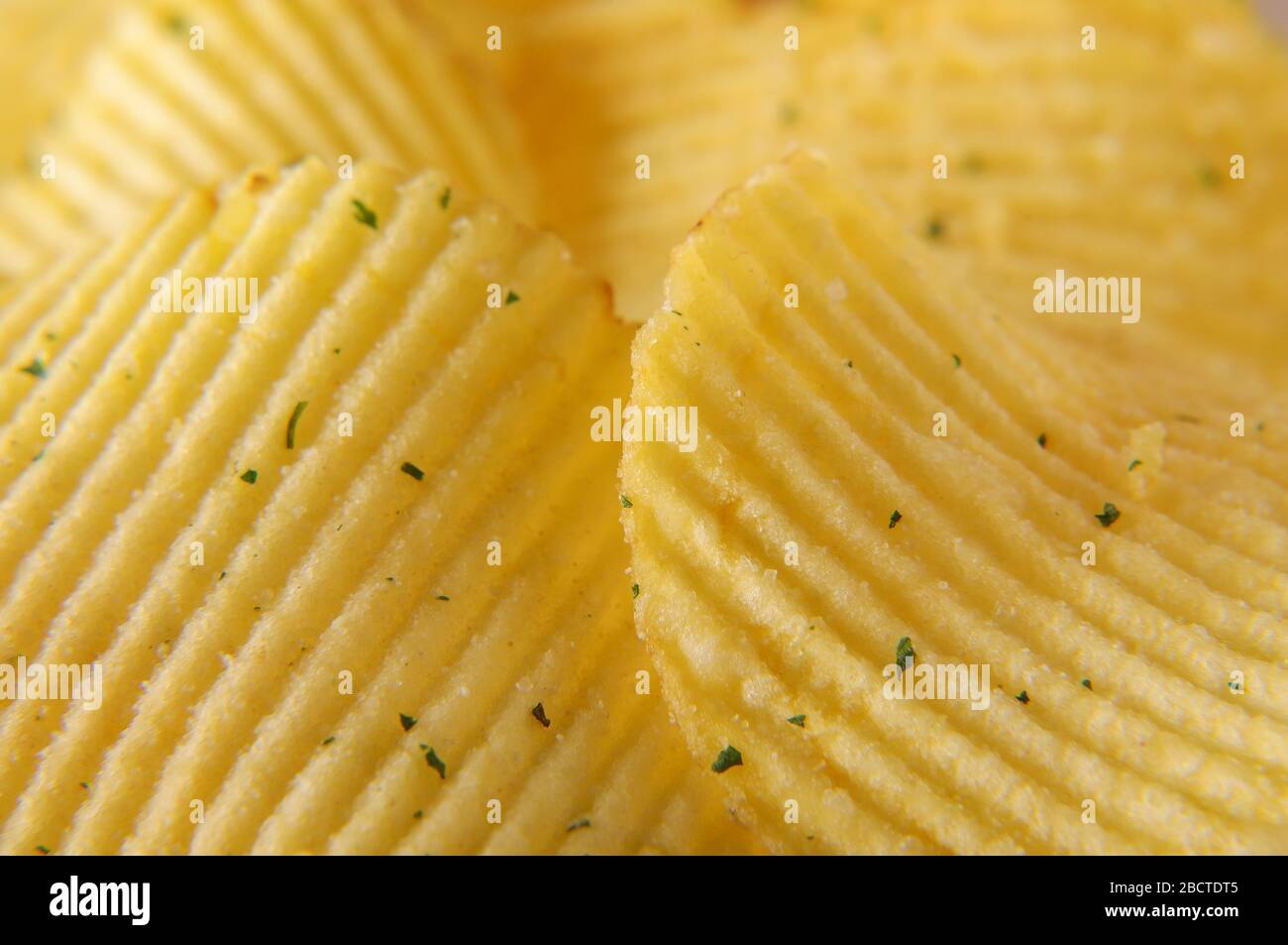 Wavy potato chips abstract texture pattern macro close up Stock Photo