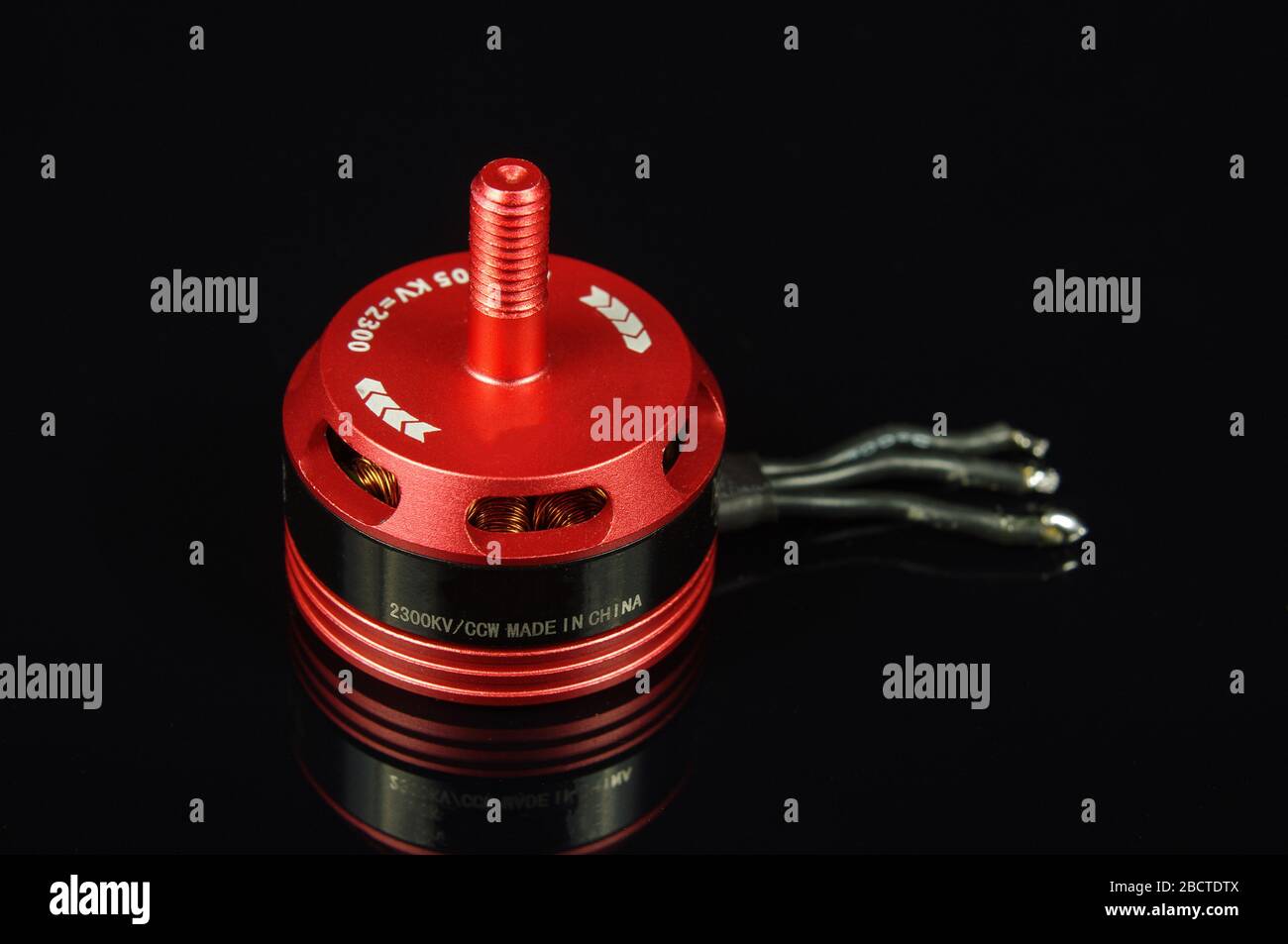 Small brushless motor for racing drones on the dark background Stock Photo Alamy