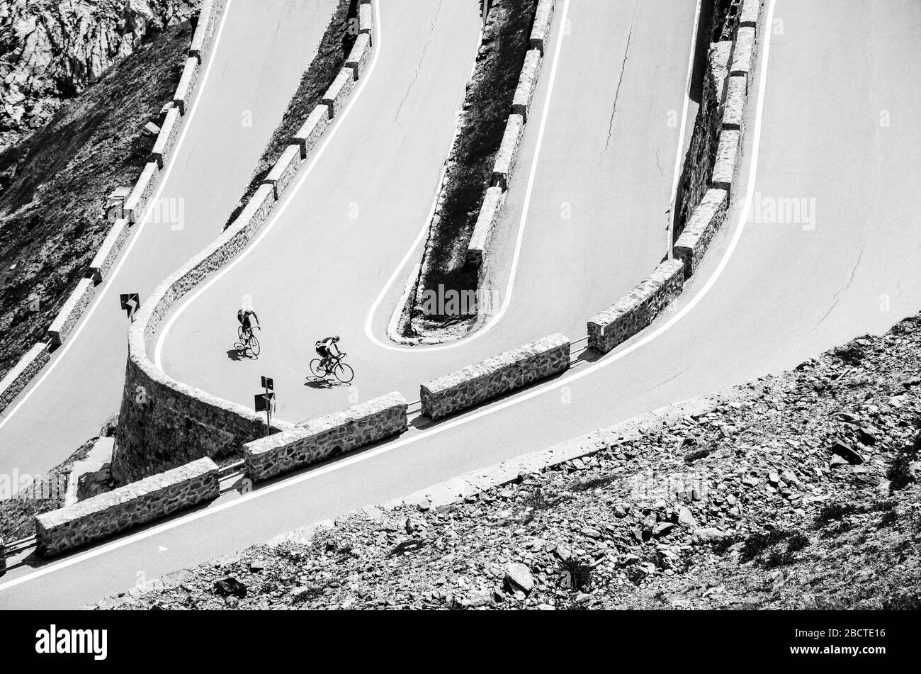 Biker on the road - Cyclist photo. Tour, Italy, Passo dello Stelvio Stock Photo