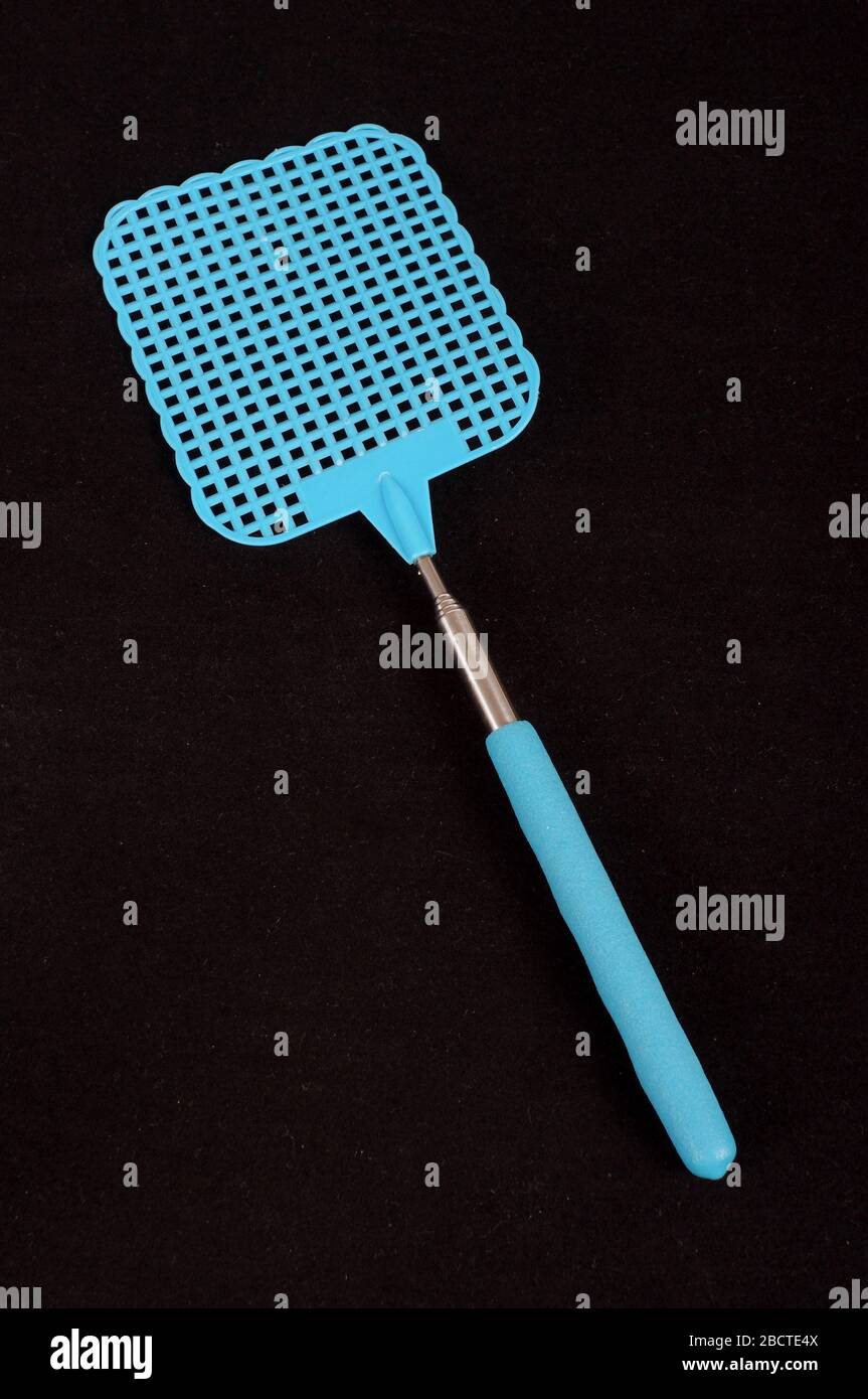 Blue fly swatter isolated on the black background Stock Photo - Alamy