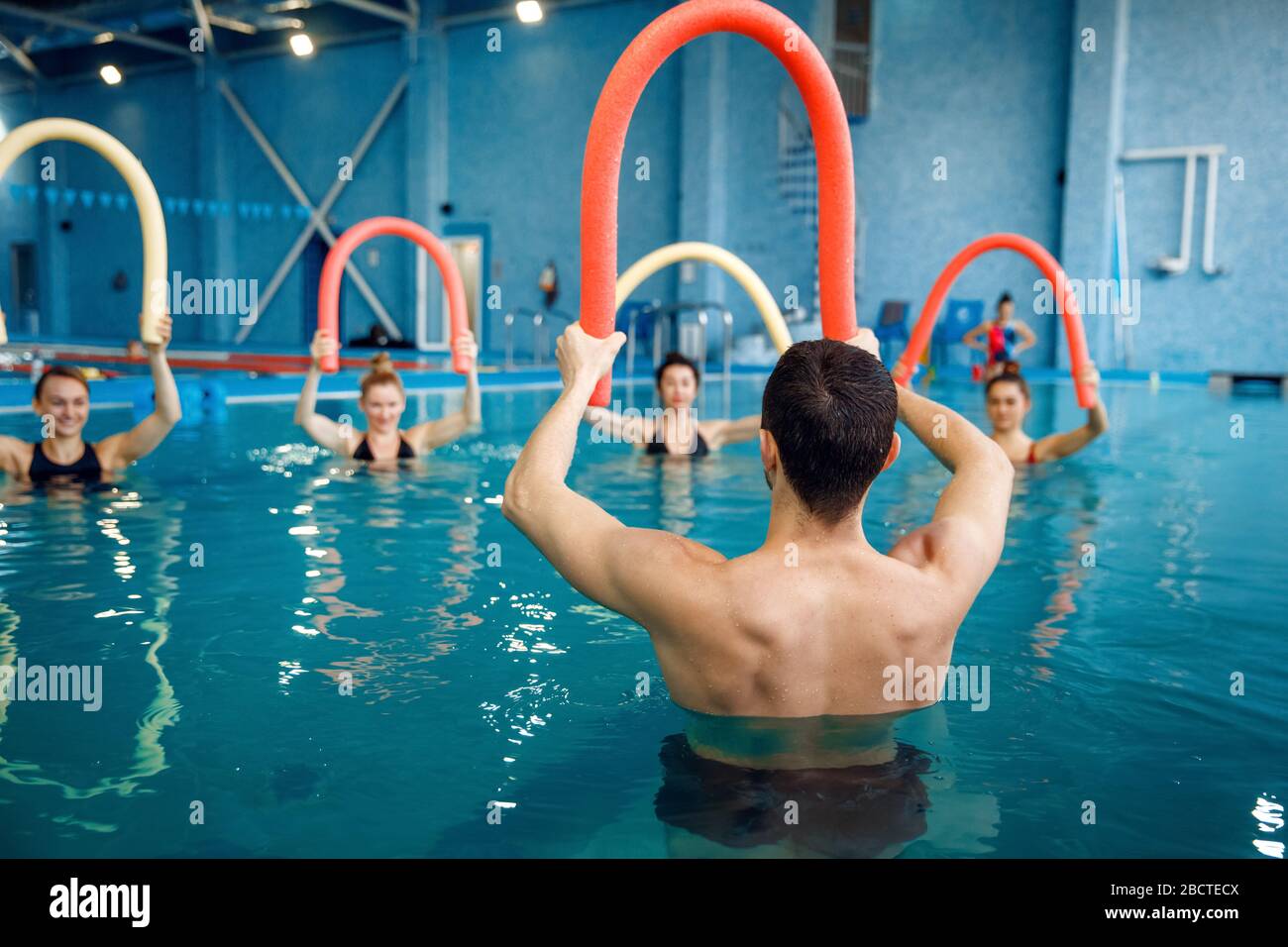 Instructor and female group, training in the pool Stock Photo Alamy
