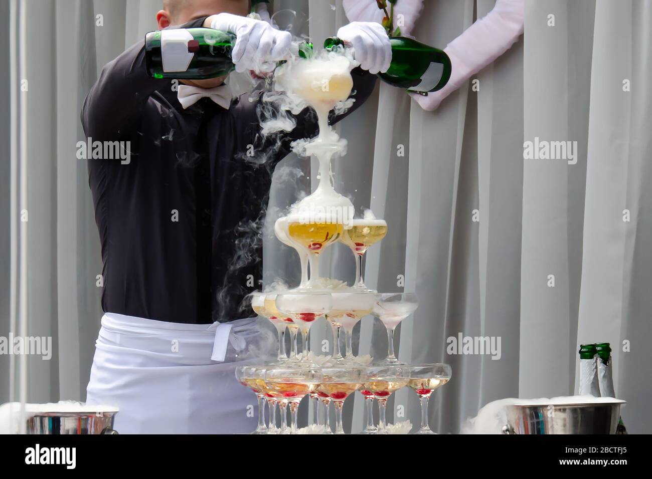 Catering service. Wedding slide champagne for bride and groom outdoors. Catering bar for celebration Stock Photo