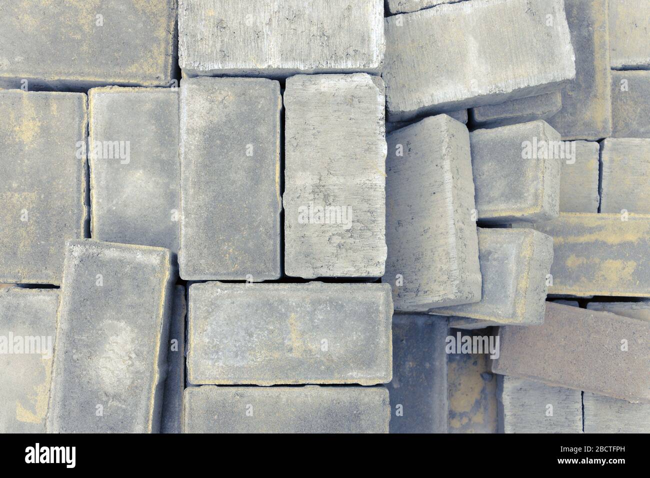paving bricks lie on a pallet ready for construction work on laying paving slabs on the road or sidewalk Stock Photo