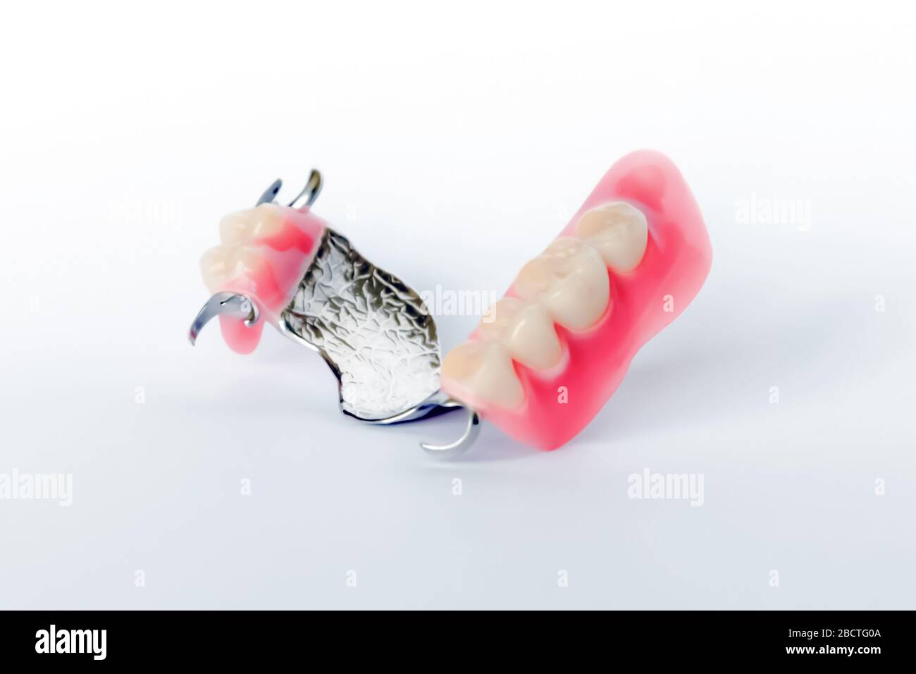 Denture clasp on white background hires stock photography and images