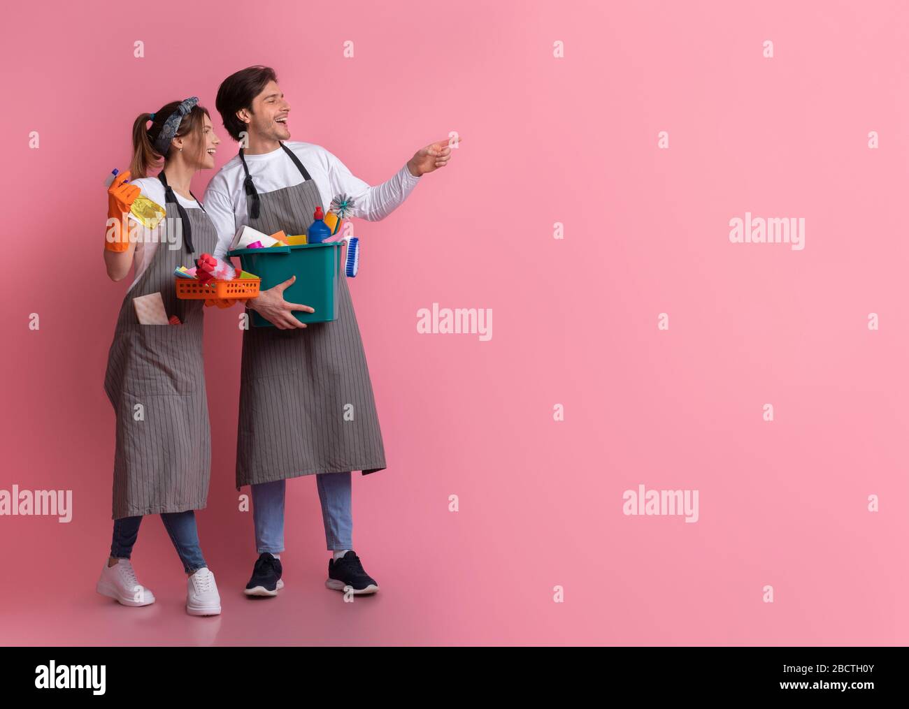 Happy couple holding buckets hi-res stock photography and images - Alamy