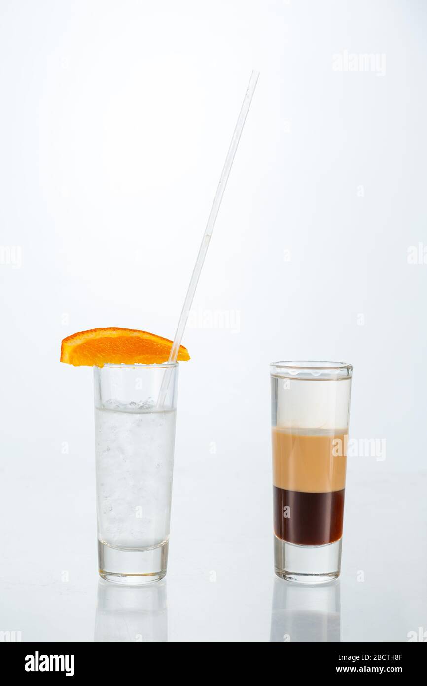 Close up of glass of b-52 cocktail on white background with copy space. Stock Photo