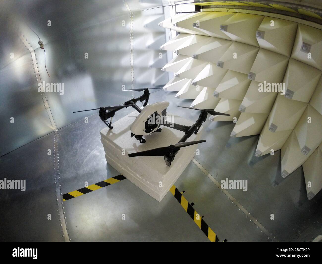 Quadcopter drone electromagnetic compatibility testing inside GTEM cell Stock Photo