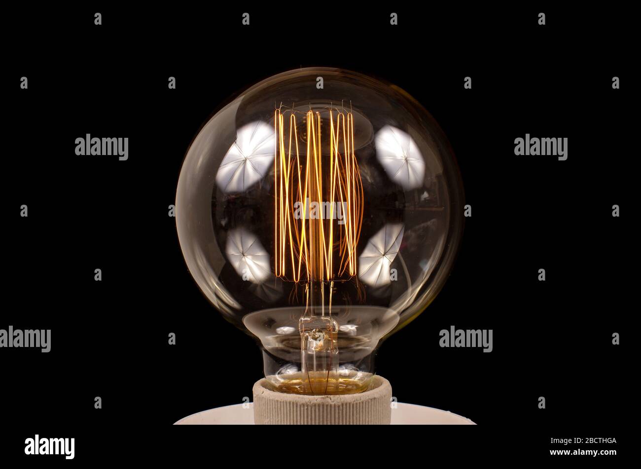 Old style light bulb with filament Stock Photo Alamy