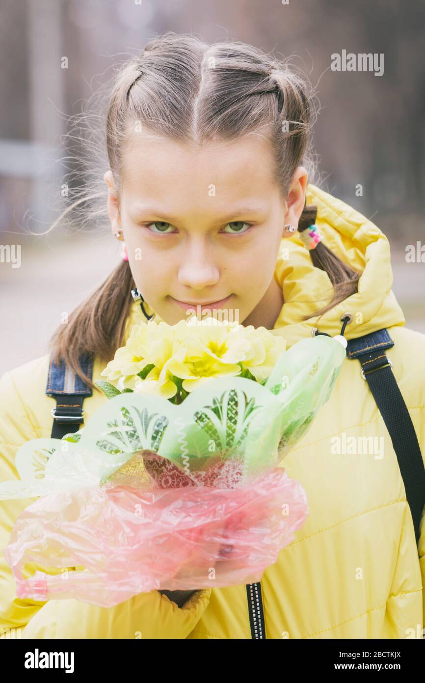 Portrait of a girl with flowers. Stock Photo
