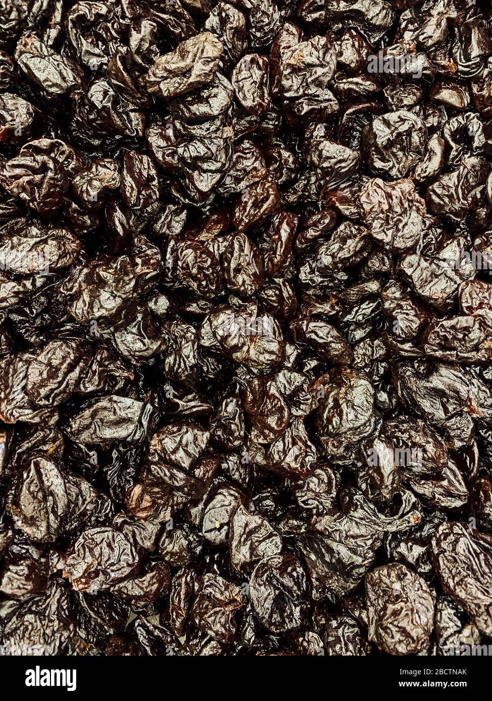 lots of dried prunes for eating background Stock Photo Alamy