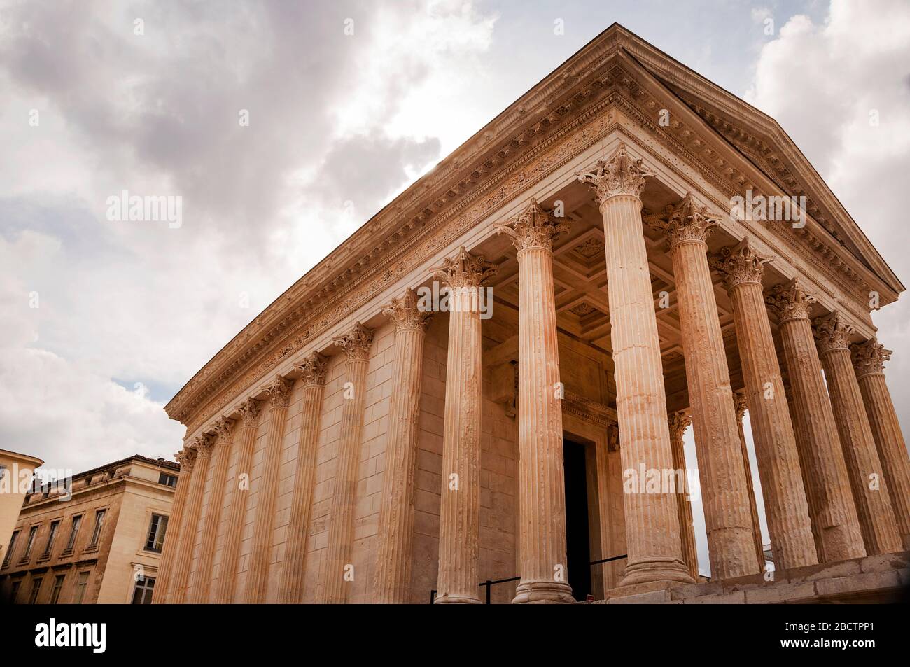 Executed in the Corinthian order, meaning the columns on the sides and back are engaged, or attached to the wall, Maison Carrée, Nîmes, France. Stock Photo