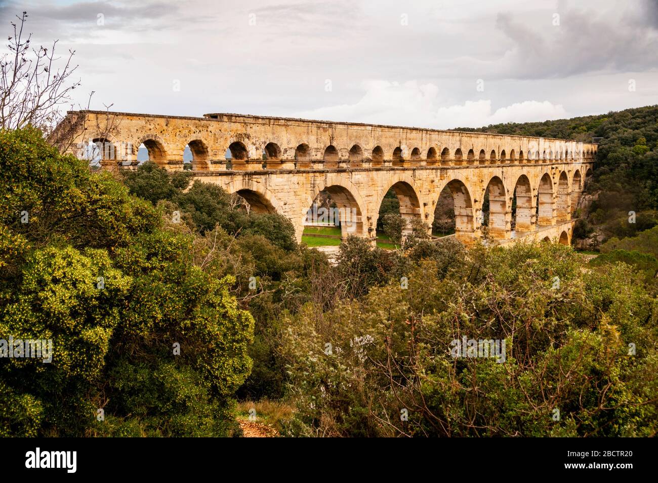 Pont du Gard ancient Roman three-tiered aqueduct used to carry water 31 miles to Nîmes, France. Stock Photo