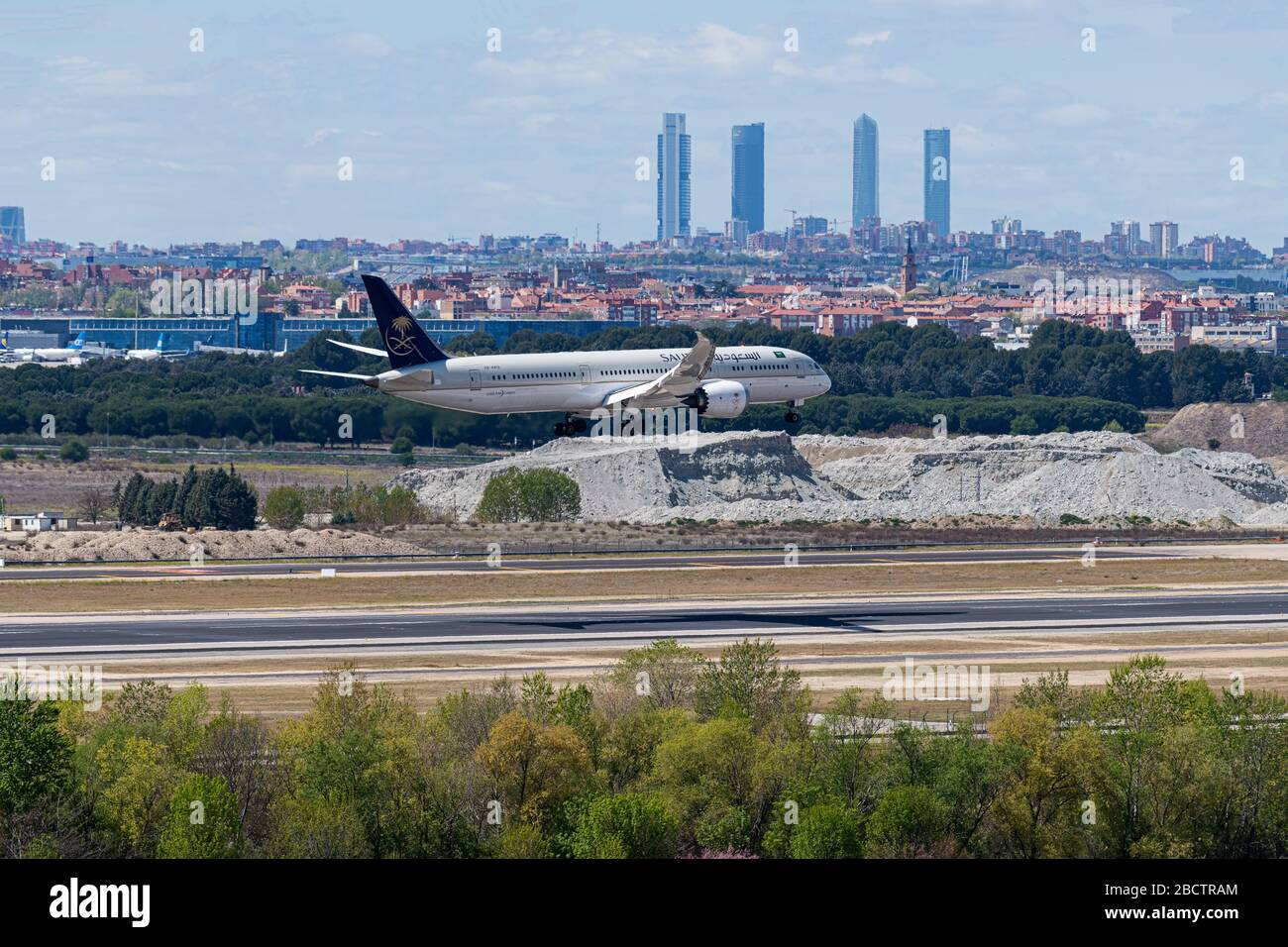 MADRID, SPAIN - APRIL 14, 2019: Saudi Arabian Airlines Boeing 787 passenger plane landing at Madrid-Barajas International Airport Adolfo Suarez In the Stock Photo