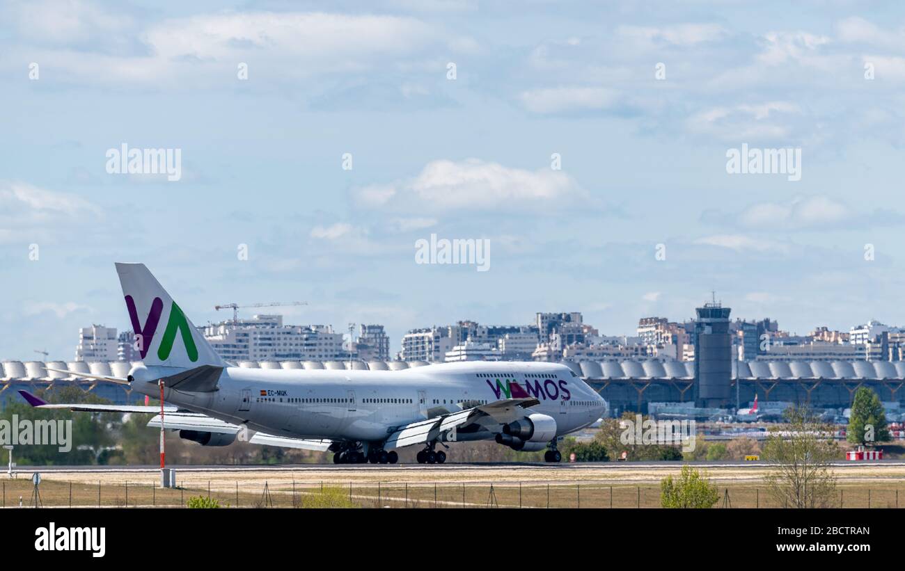 MADRID, SPAIN - APRIL 14, 2019: VAMOS Airlines Boeing 747 passenger plane landing at Madrid-Barajas International Airport Adolfo Suarez . Stock Photo