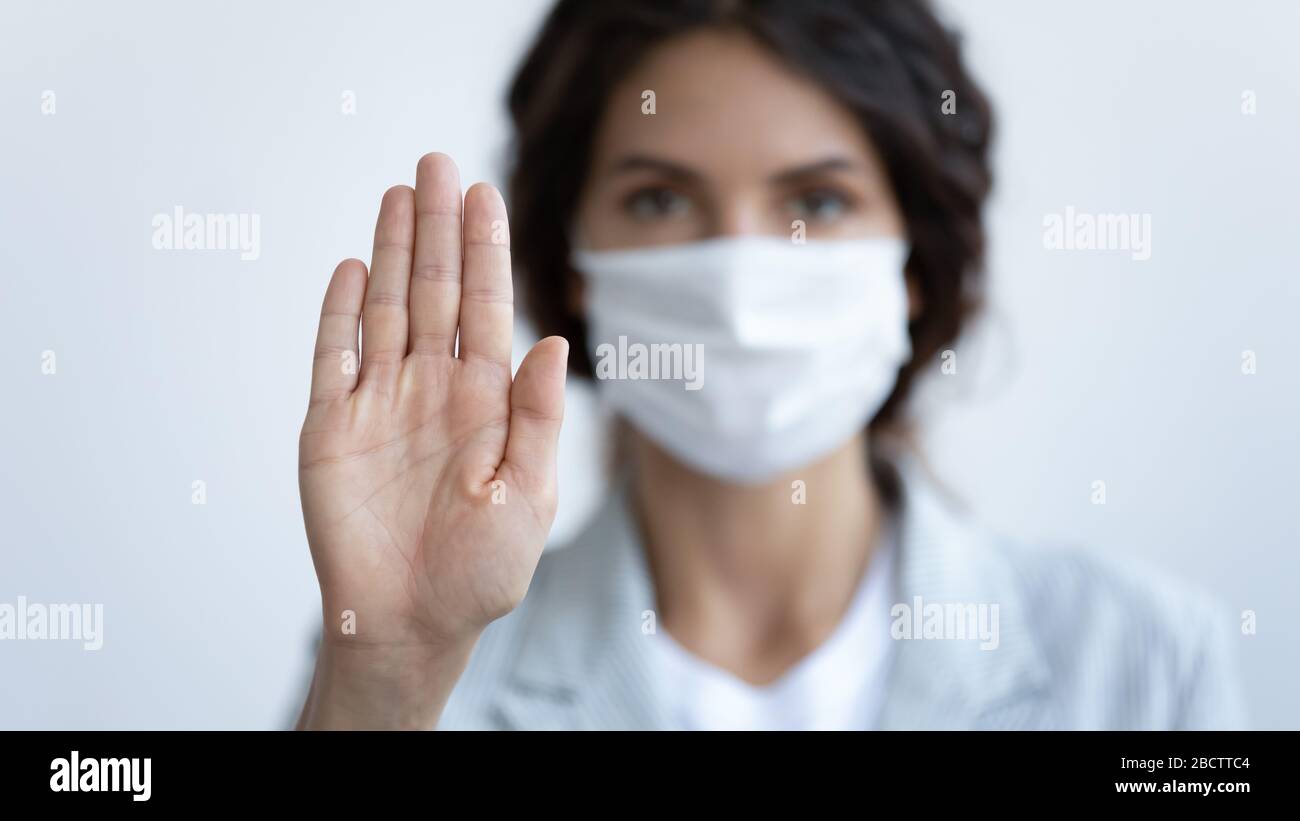 Focus on female hand showing stop gesture Stock Photo - Alamy