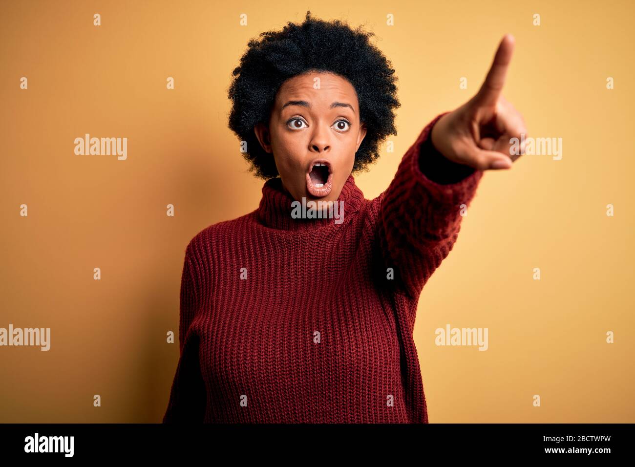 Young beautiful African American afro woman with curly hair wearing ...