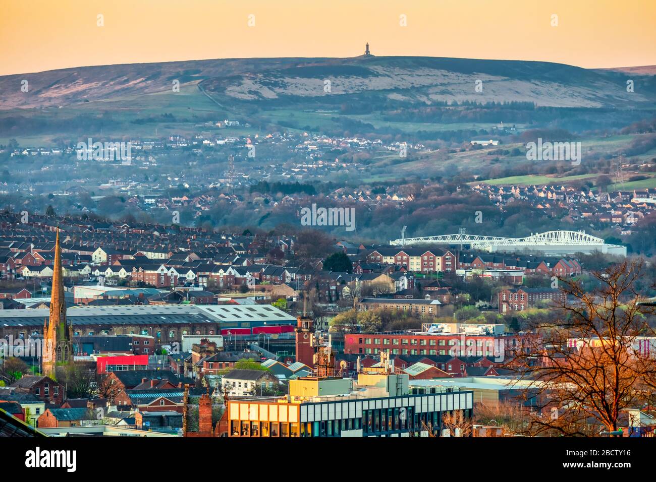 Blackburn Town with Darwen Moors in the distance Stock Photo