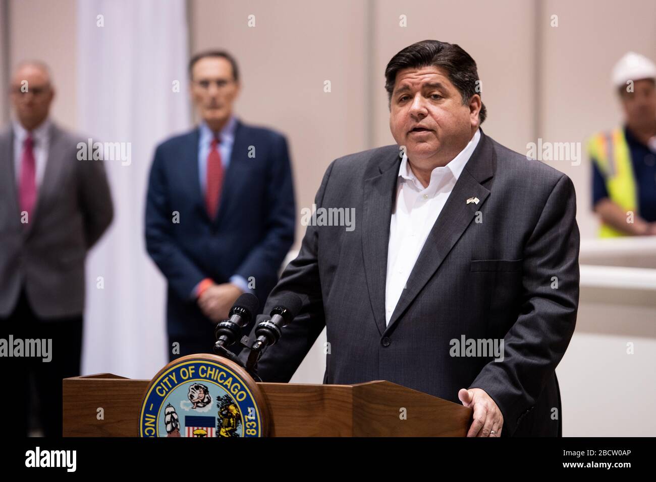 Illinois Governor Jay Pritzker speaks to the press at McCormick Place ...