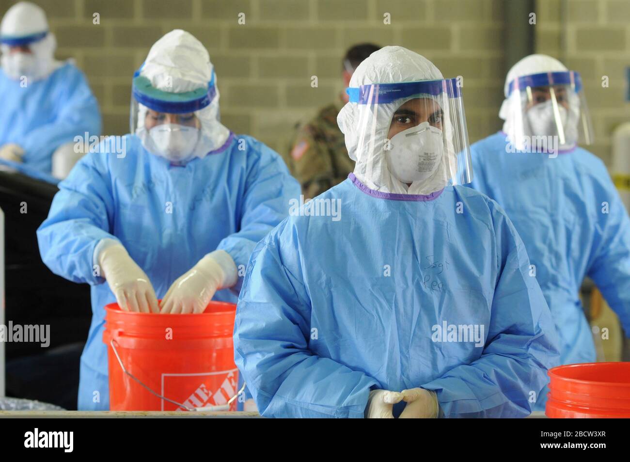 Illinois National Guard medical staff wait to test patients for COVID-19, coronavirus screening at a drive up testing center March 24, 2020 in Chicago, Illinois. Stock Photo