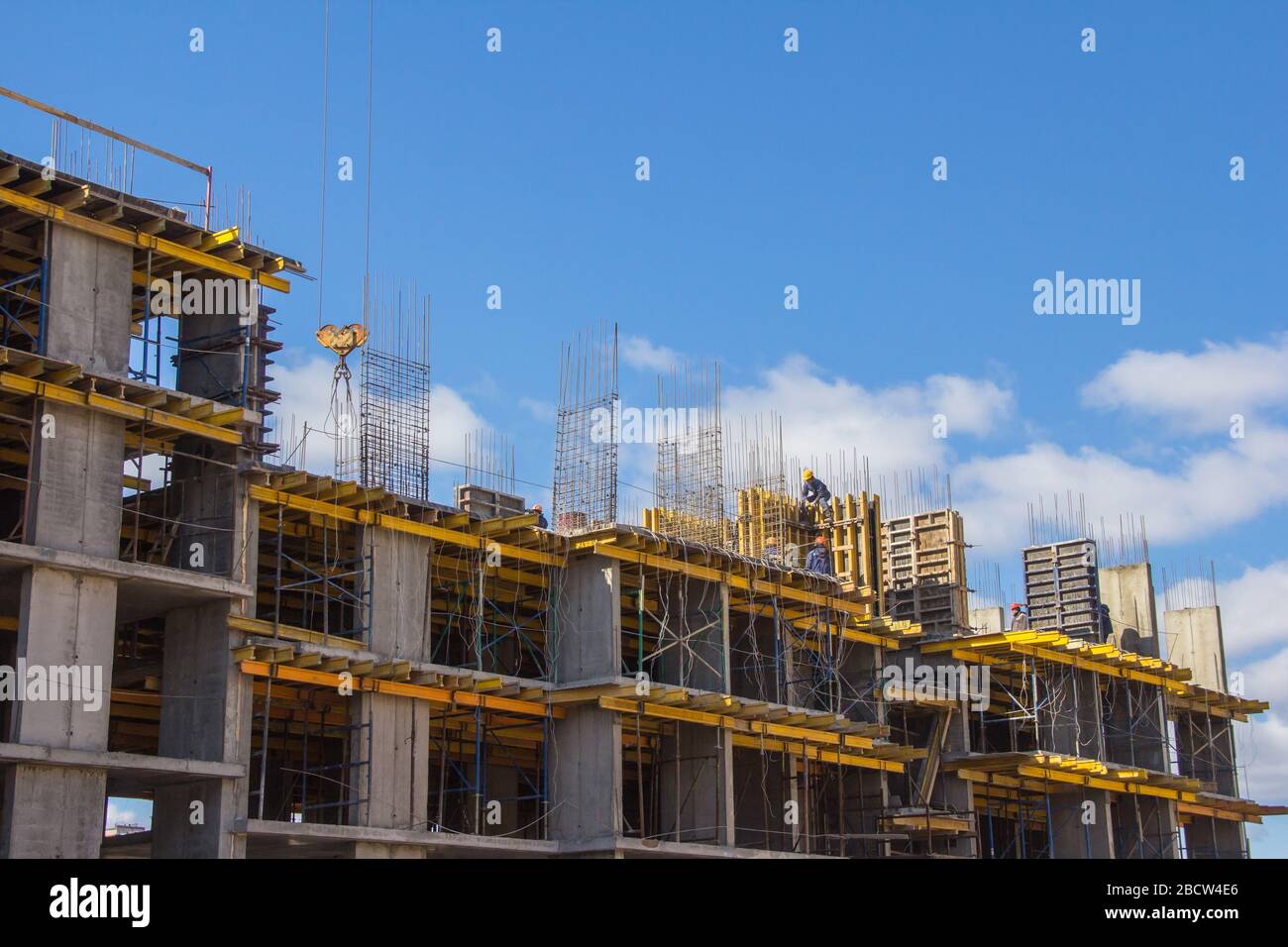Concrete frame of the building against the sky. Concrete construction ...