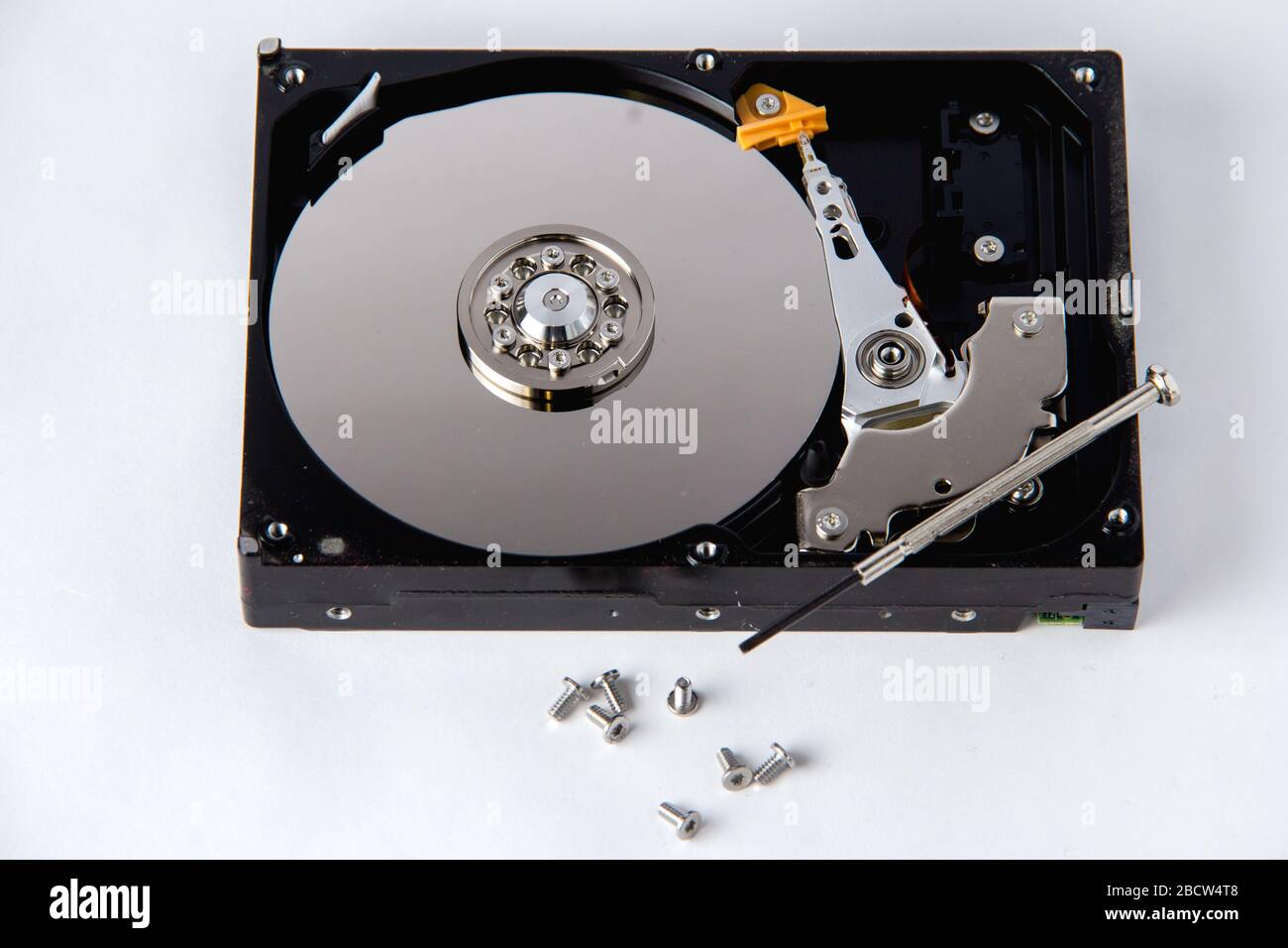 Opened computer hard drive on a white background. Data storage. Computer device Stock Photo