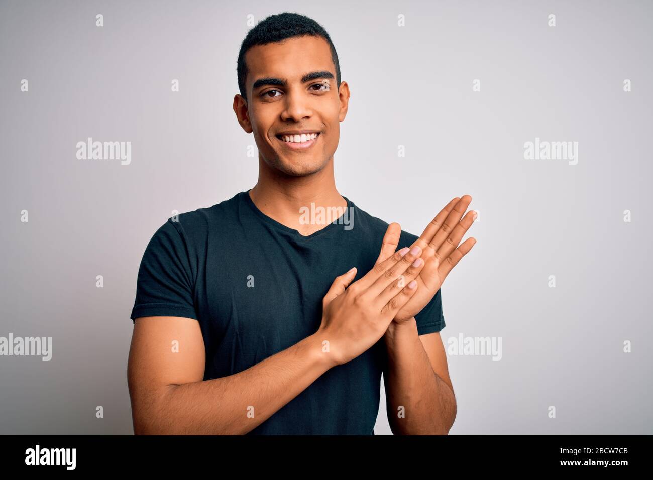 Joyful black man clapping hands hi-res stock photography and images - Alamy