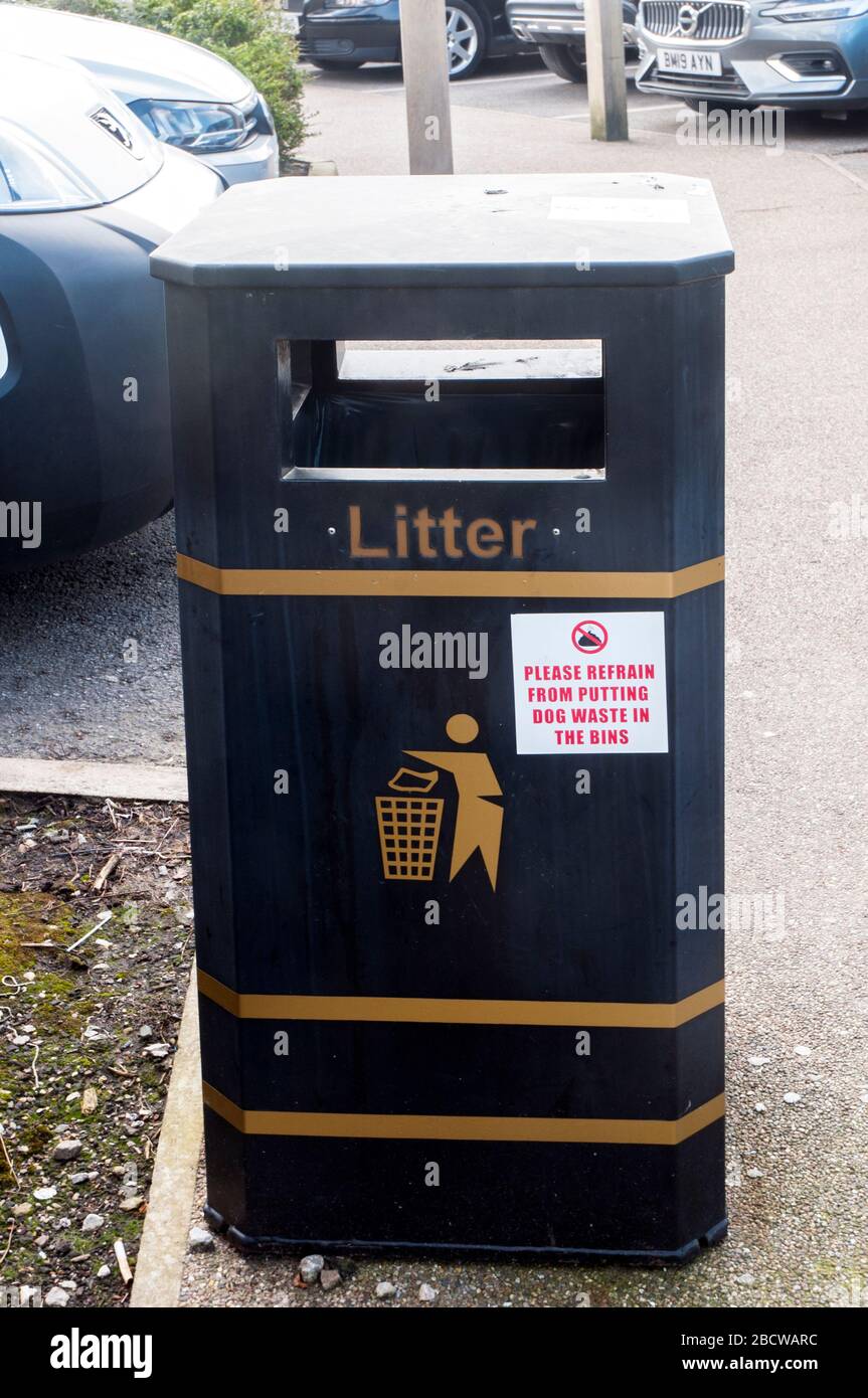 Notice on litter bin in car park. Please refrain from putting dog waste