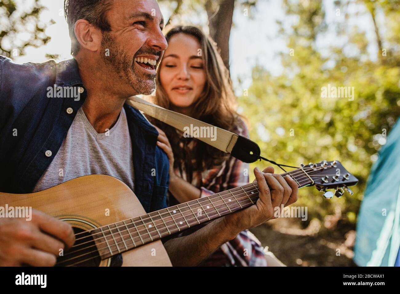 Smiling mature woman camping in hi-res stock photography and images - Alamy
