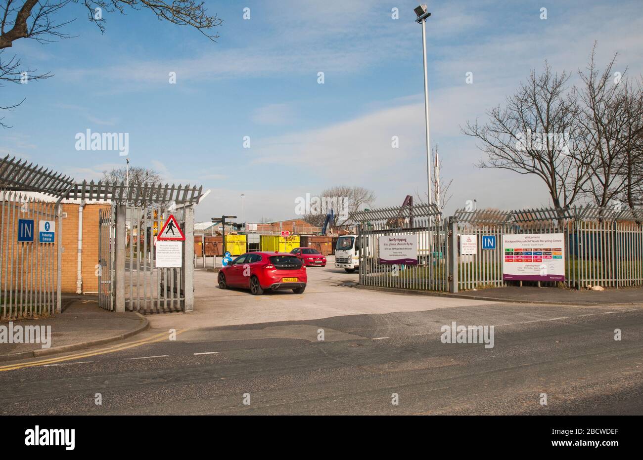 Red car entering Blackpool Household Waste Recycling Centre. Open to Blackpool residents to dispose of waste six days a week Friday to Wednesday Stock Photo